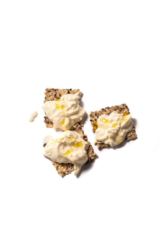 Fresh stracciatella cheese, torn mozzarella strands in cream, made in Bali